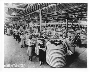 1930s-5 -
Western Electric cable plant. Women inspection of lead-covered cable.