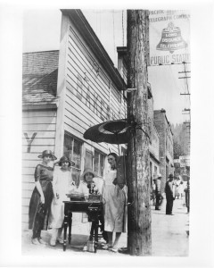 1920s-3 -
Manning a public telephone mounted on a utility pole, traffic operators make sure communications were not interrupted following a 1926 fire.