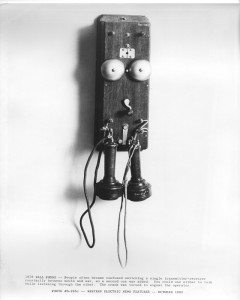 1878 -
1878 Wall Telephone - People often became confused switching a single transmitter-receiver constantly between mouth and ear, so a second one was added. You could use either to talk while listening through the other. The crank was turned to signal the operator.